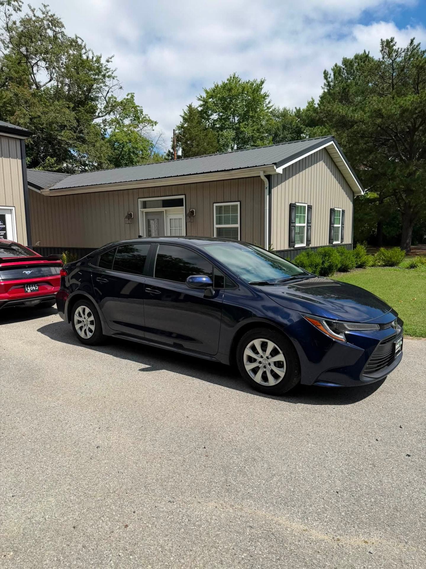 Blue Toyota Corolla sedan with 15% ceramic window tint installed by Venom Films in Felton, Delaware