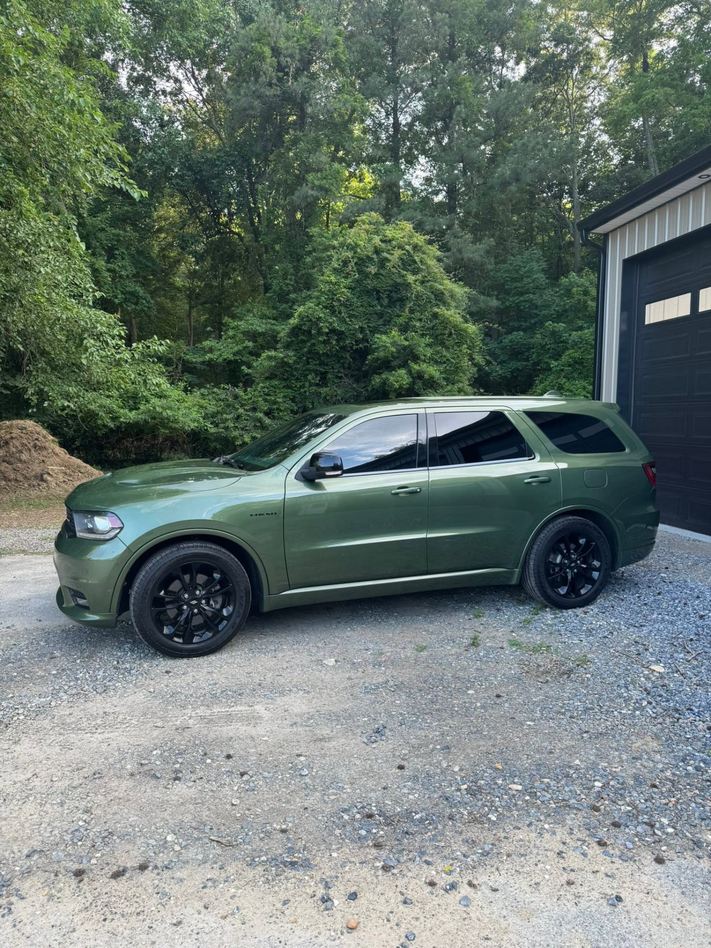 Green Dodge Durango SUV with 5% ceramic window tint on the front two windows installed by Venom Films in Felton, Delaware