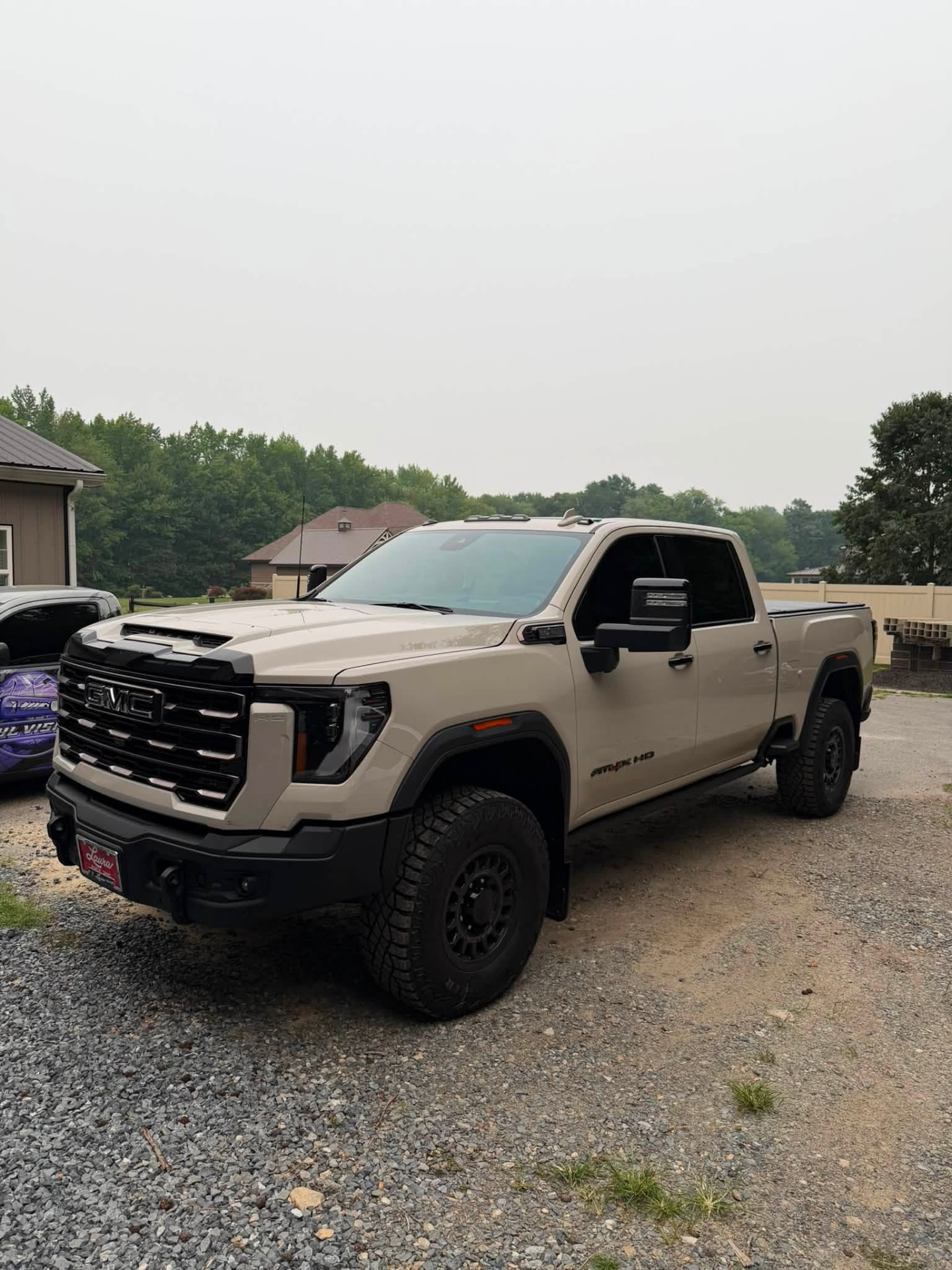 Tan GMC Sierra AT4X HD pickup truck with window tint installed by Venom Films in Felton, Delaware